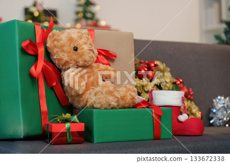 SSTK Christmas. Festive scene with teddy bear and wrapped gifts. 133672338