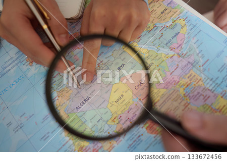 Travel Planning. Close-up of hands pointing at a map. Travel Planning. Close-up of hands pointing at a map. 133672456