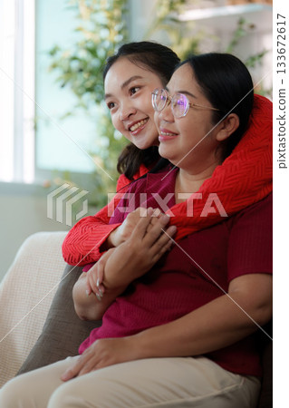 Joyful Embrace. Two women sharing a loving hug, showcasing emotional support. Joyful Embrace. Two women sharing a loving hug, showcasing emotional support. 133672617