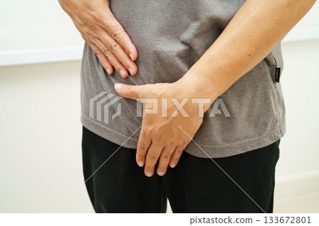 Hernia, Asian man stomach ache, abdominal pain and urology problem health. 133672801