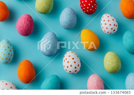 Colorful pattern composition made of various colored Easter eggs on light blue background. Minimal Easter concept. Creative festive spring holiday backdrop. Easter aesthetic. Flat lay, top of view. 133674065
