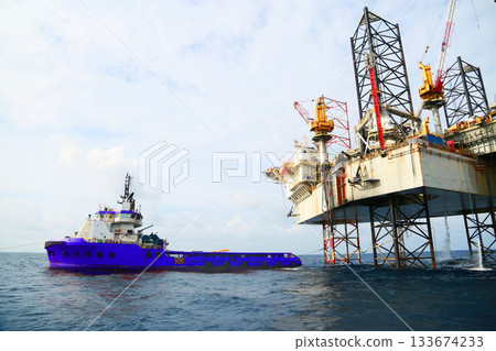 Oil and rig in offshore with sunset and sunrise time. The construction platform for production oil and gas in power and energy industry. 133674233