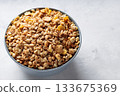 Bowl of Dry Granola Cereal on Gray Background Nutritious Snack Copy Space Bowl of Dry Granola Cereal on Gray Background Nutritious Snack Copy Space 133675369