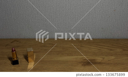 Stylish lipstick and compact against textured background. 133675899
