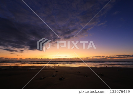 beautiful beach sunrise 133676429