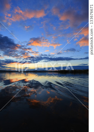 Asahi reflected on the surface of the water Asahi reflected on the surface of the water 133676671