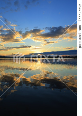 Asahi reflected on the surface of the water Asahi reflected on the surface of the water 133676696