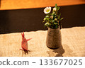 Image of flowers in a vase and an origami rabbit 133677025