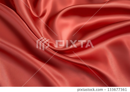 Luxurious Red Satin Fabric Surface with Smooth Texture and Elegant Drapery folds 133677361