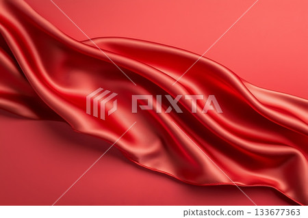 Flowing Red Silk Fabric on a Smooth Surface Creating a Luxurious and Elegant Appearance 133677363