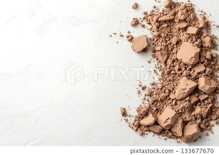 Light Brown Powdery Substance on White Background for Natural and Organic Concepts 133677670