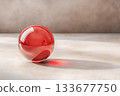 Transparent Red Glass Sphere on a Light Neutral Background with Soft Shadows Transparent Red Glass Sphere on a Light Neutral Background with Soft Shadows 133677750
