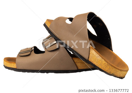 Brown leather sandals on white background Brown leather sandals on white background 133677772