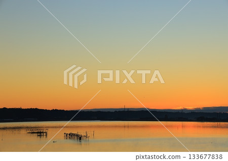 Asahi reflected on the surface of the water 133677838