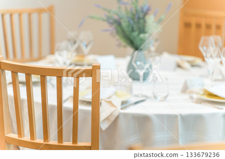 Floral decorations on tables at a wedding reception 133679236