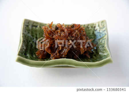 Dried chirimen with Japanese pepper served on a small plate Dried chirimen with Japanese pepper served on a small plate 133680341