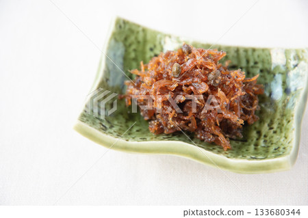 Dried chirimen with Japanese pepper served on a small plate Dried chirimen with Japanese pepper served on a small plate 133680344