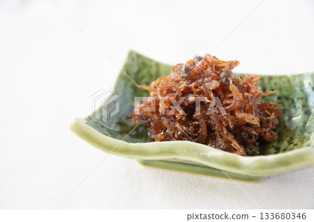 Dried chirimen with Japanese pepper served on a small plate Dried chirimen with Japanese pepper served on a small plate 133680346