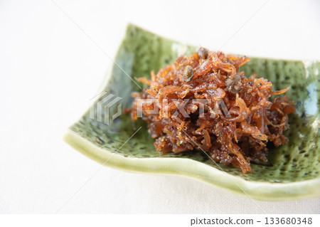Dried chirimen with Japanese pepper served on a small plate 133680348