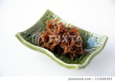 Dried chirimen with Japanese pepper served on a small plate Dried chirimen with Japanese pepper served on a small plate 133680363