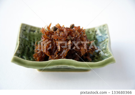 Dried chirimen with Japanese pepper served on a small plate Dried chirimen with Japanese pepper served on a small plate 133680366