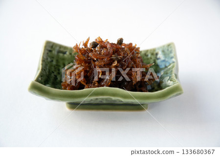 Dried chirimen with Japanese pepper served on a small plate 133680367