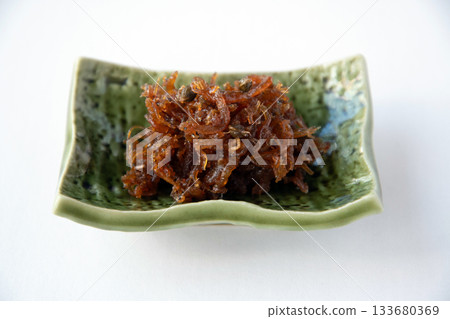 Dried chirimen with Japanese pepper served on a small plate 133680369