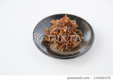 Dried chirimen with Japanese pepper served on a small plate Dried chirimen with Japanese pepper served on a small plate 133680376