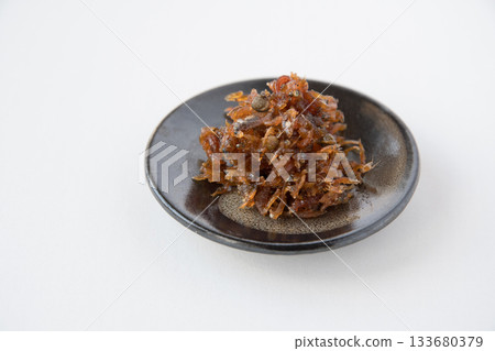 Dried chirimen with Japanese pepper served on a small plate Dried chirimen with Japanese pepper served on a small plate 133680379
