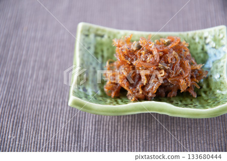 Dried chirimen with Japanese pepper served on a small plate Dried chirimen with Japanese pepper served on a small plate 133680444