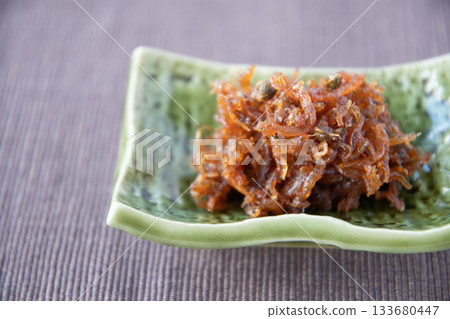 Dried chirimen with Japanese pepper served on a small plate Dried chirimen with Japanese pepper served on a small plate 133680447