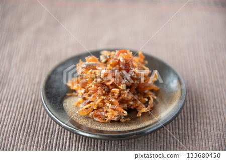 Dried chirimen with Japanese pepper served on a small plate Dried chirimen with Japanese pepper served on a small plate 133680450