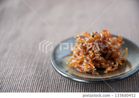 Dried chirimen with Japanese pepper served on a small plate Dried chirimen with Japanese pepper served on a small plate 133680452