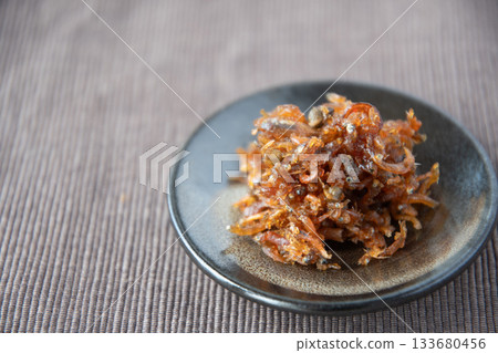 Dried chirimen with Japanese pepper served on a small plate Dried chirimen with Japanese pepper served on a small plate 133680456