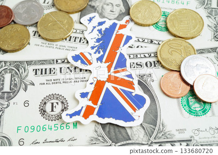 United Kingdom flag on coin and banknote money, finance trading investment business currency concept. 133680720