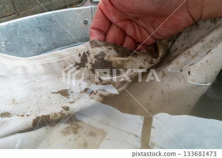 Mud stains on work clothes won't come off 133681473