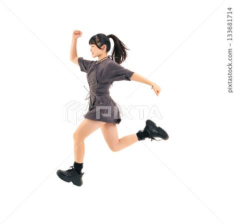 A teenage girl running energetically. A transparent background full-body photo PNG, precisely cut out by hand. A teenage girl running energetically. A transparent background full-body photo PNG, precisely cut out by hand. 133681714