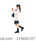 Female student in uniform walking while looking at her smartphone. Full-body photo PNG with transparent background, precisely cut out by hand. 133681727