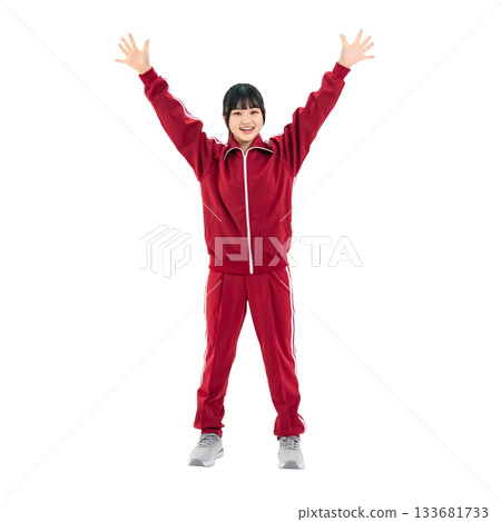 Female student in gym jersey raising her arms in a cheer. Full-body photo PNG with transparent background, precisely cut out by hand. 133681733