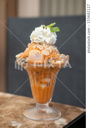 Shaved ice Bingsu with milk, Thai tea with whipped cream. 133682117