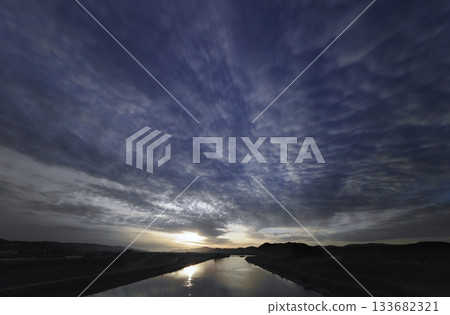 A refreshing morning sky with a variety of clouds and a river. Spring. Ultra-wide angle. Sky-focused. 240328am 133682321