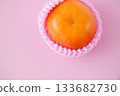 Shiny and richly sweet, the Fuyu persimmon has a vibrant warm orange color. 133682730