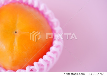 Shiny and richly sweet, the Fuyu persimmon has a vibrant warm orange color. Shiny and richly sweet, the Fuyu persimmon has a vibrant warm orange color. 133682765