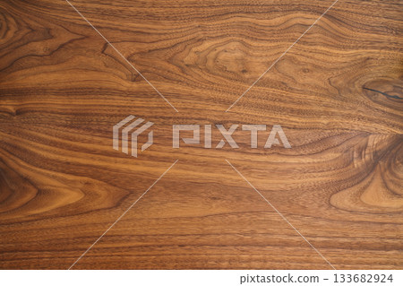 Texture of black walnut table from three boards with oil finish 133682924