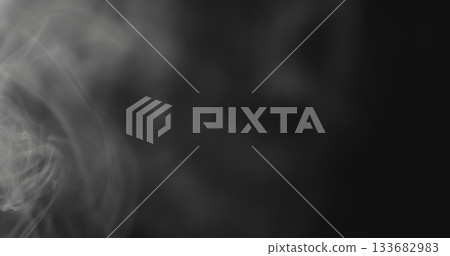 closeup vapor floating in air on black background closeup vapor floating in air on black background 133682983