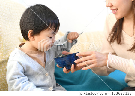 Asian mother teaching her young child about food Asian mother teaching her young child about food 133683133