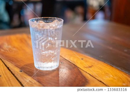 A glass of iced water on the table A glass of iced water on the table 133683316