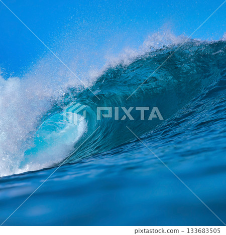 Majestic ocean swell with shimmering sunlight and foamy crest Majestic ocean swell with shimmering sunlight and foamy crest 133683505
