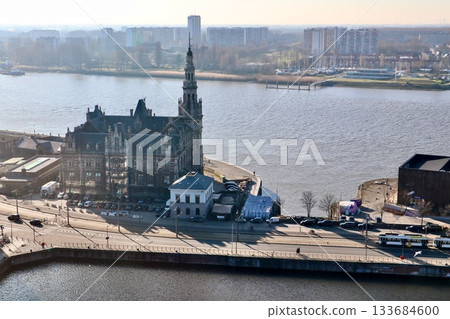 Royal Depot building and Scheldt river, Antwerp cityscape featuring historic architecture and urban waterfront views 133684600