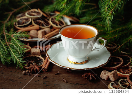 Christmas tea with spices and dried citrus slices. Christmas tea with spices and dried citrus slices. 133684894